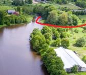 Vandens pakrantėje parduodamas 122 arų ploto sklypas su mūriniu 849 m2 ploto pastatu ir pakrantės mišku šalia Vilniaus-0